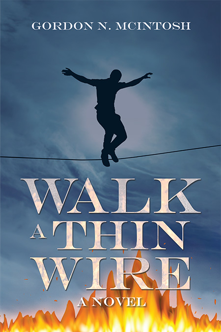 A man walking across a tight rope on a tightrope.
